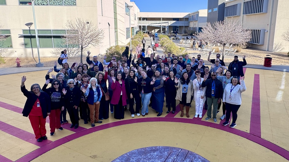 a group of teachers outside Centennial High School