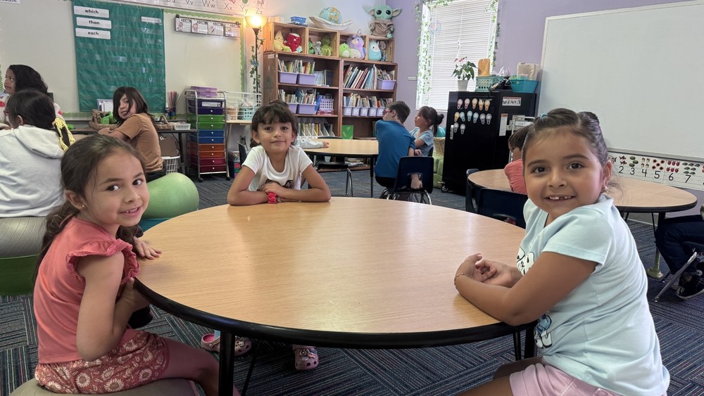 kids in a classroom around a table