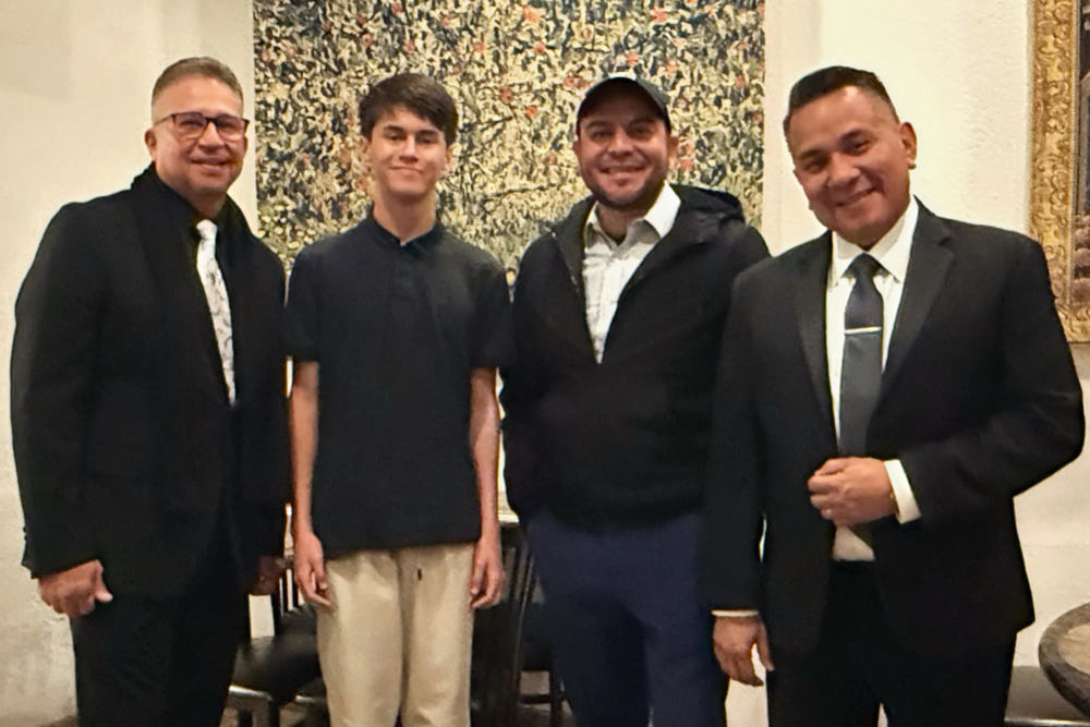 photo of three city leaders with student