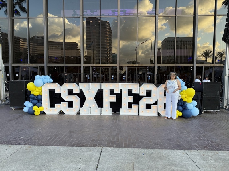 photo of woman standing in front of building