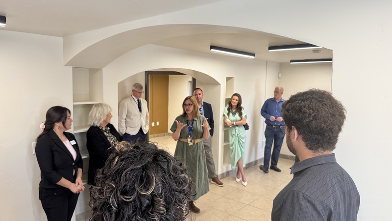 photo of people standing in a room