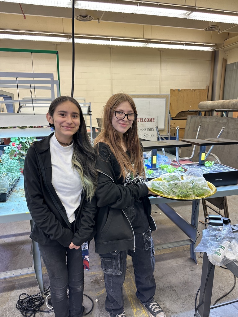 students posing with work