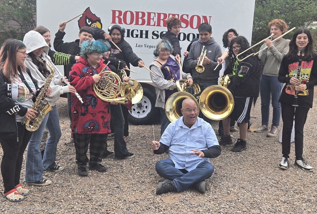 students posing with their instruments
