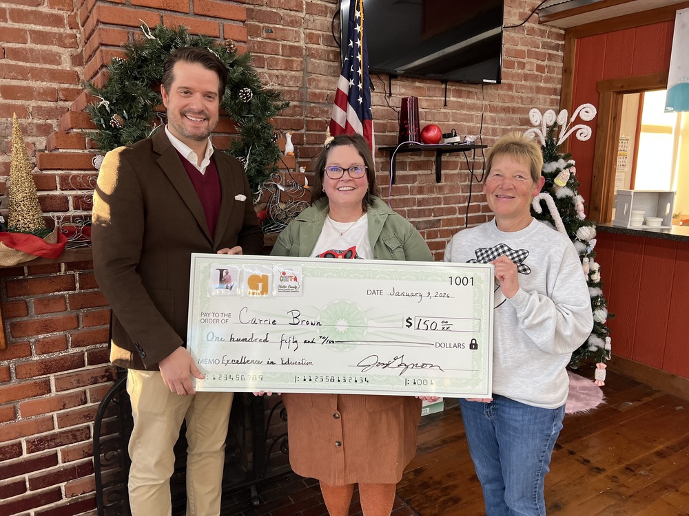 Image of Ms. Brown receiving Excellence in Education Award