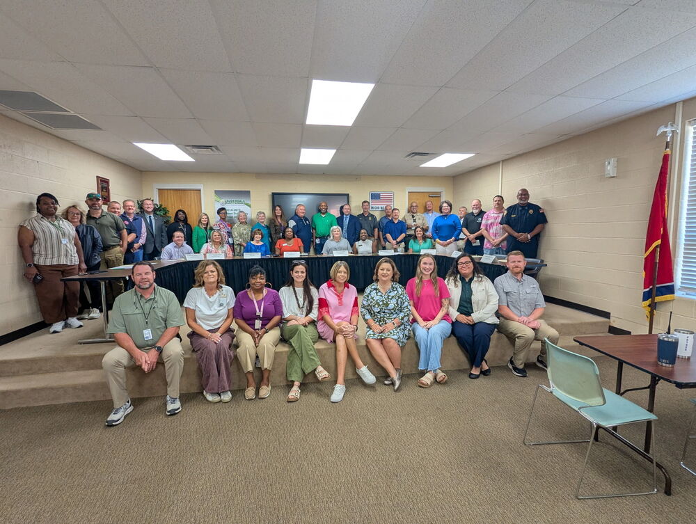 Community members gathered to sign a Reunification MOU agreement.