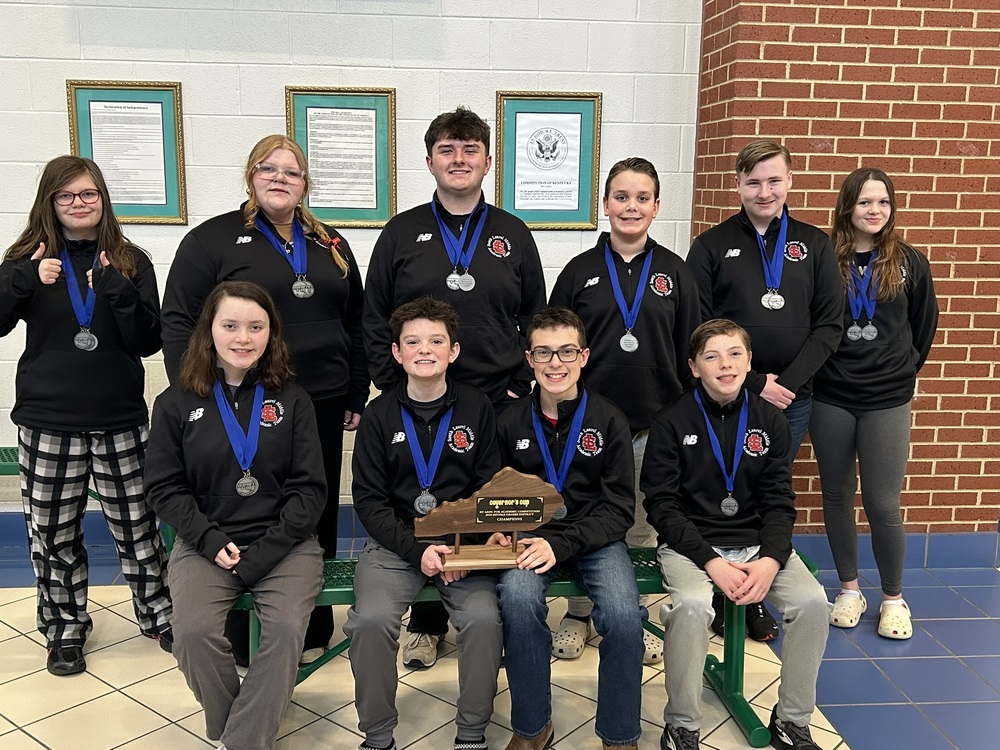 academic team poses with district trophy and medals