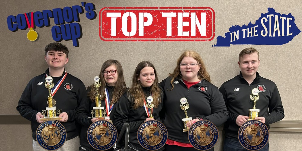 top ten students posing with trohies