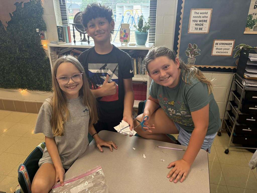Students all smiles after completing container project