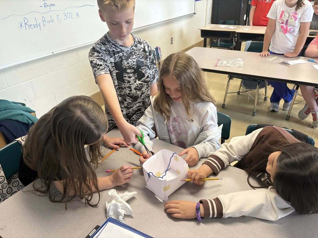 Students working collaboratively on container project