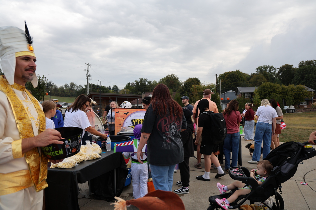 Assistant Superintendent Dr. Jeremy Kidd handing out candy