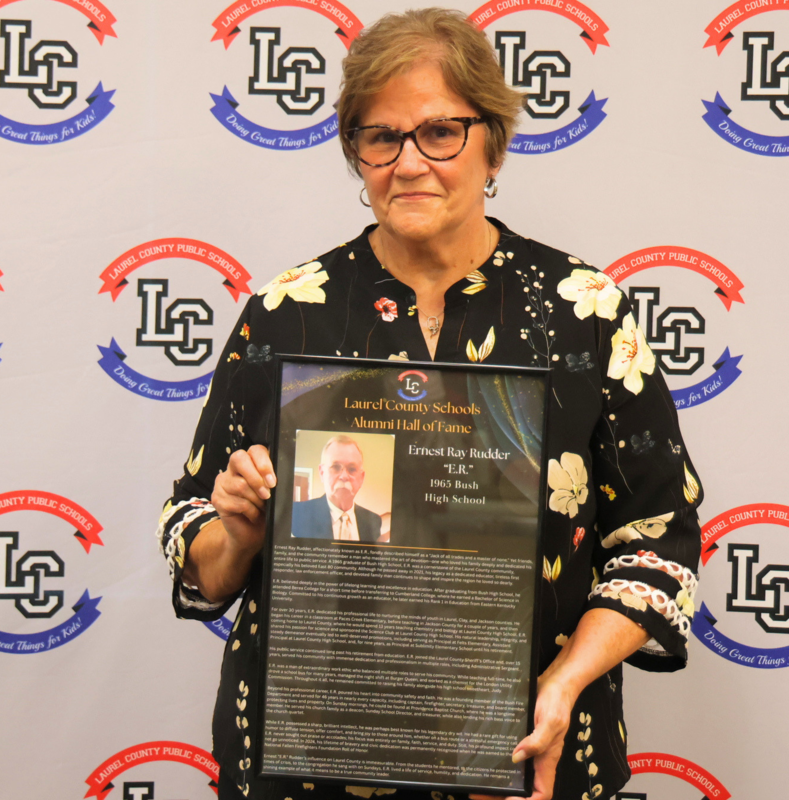 Judy Rudder accepting honor on behalf of her late husband, ER Rudder