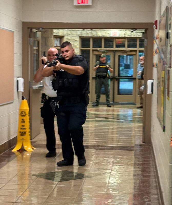 Training at London Elementary with officer's training on how to approach a suspect