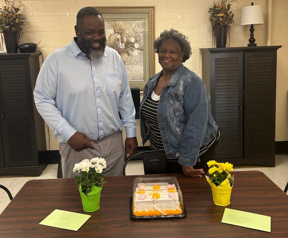 Mr. and Mrs. Smith with their gifts