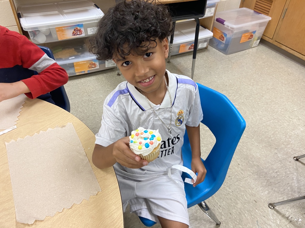 Student holding a cupcake