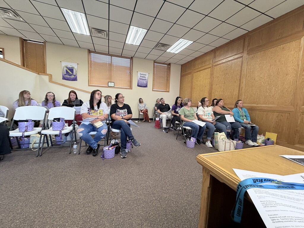 photos of staff listening to presenters from the District. 