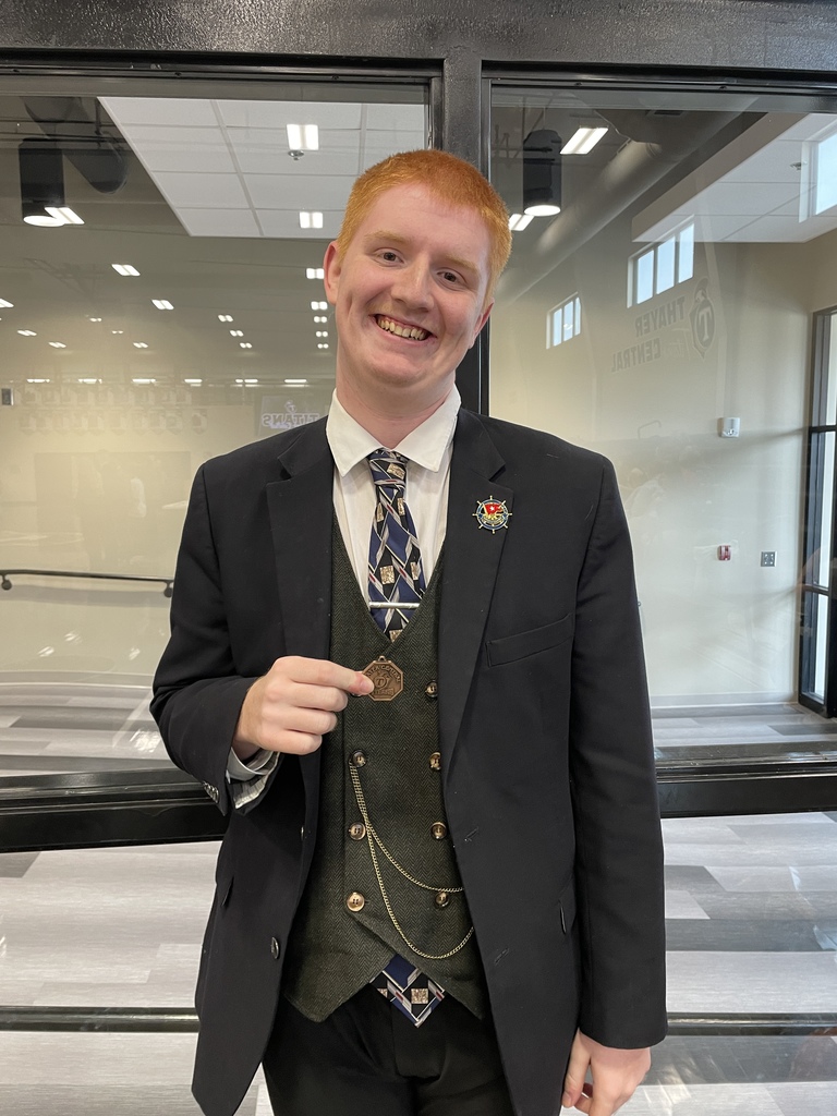 Parker poses with medal.