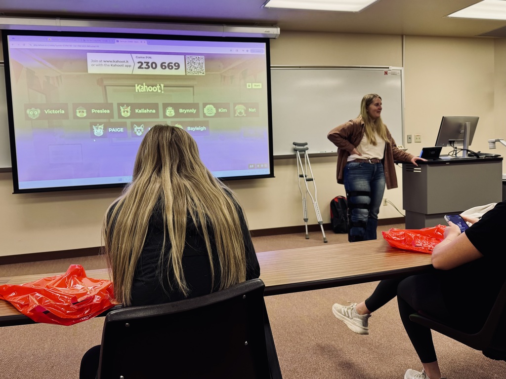 Participating in a Kahoot! learning experience in the classroom with our tour guide.