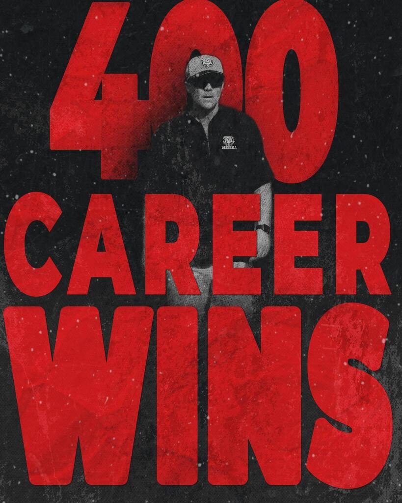 Bold red text on black background reads "400 Career Wins". A person stands in the center, wearing sunglasses and a black shirt.