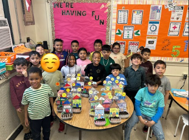 Two classes with their greenhouses