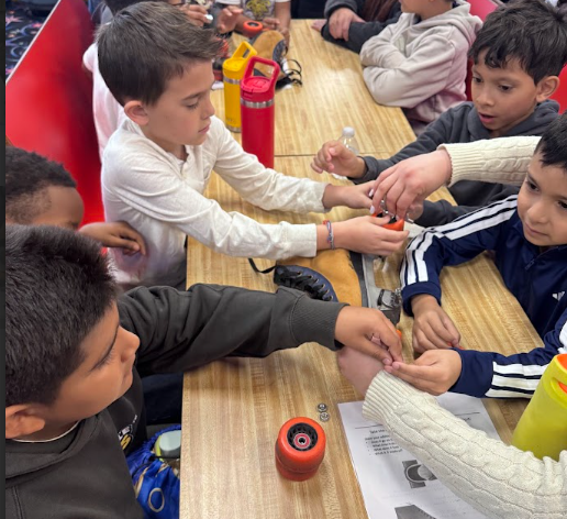 Ms. Brites' students taking apart a roller skate