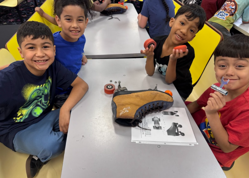 Ms. Brown's students taking apart a roller skate