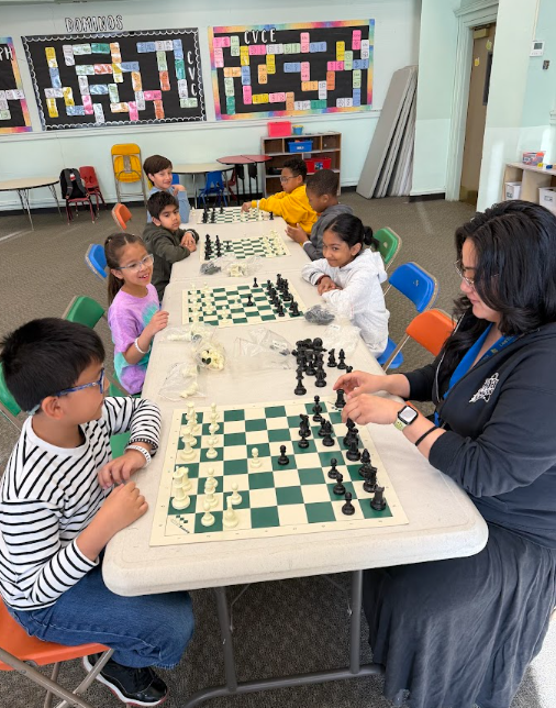 Ms. B playing chess with students