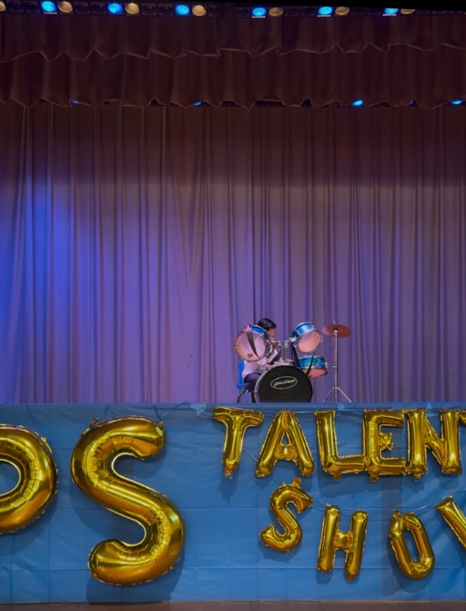 Derek performing on drums