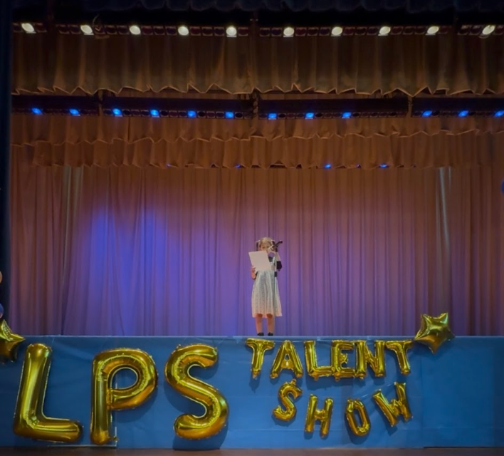 Leah performing a comedy act