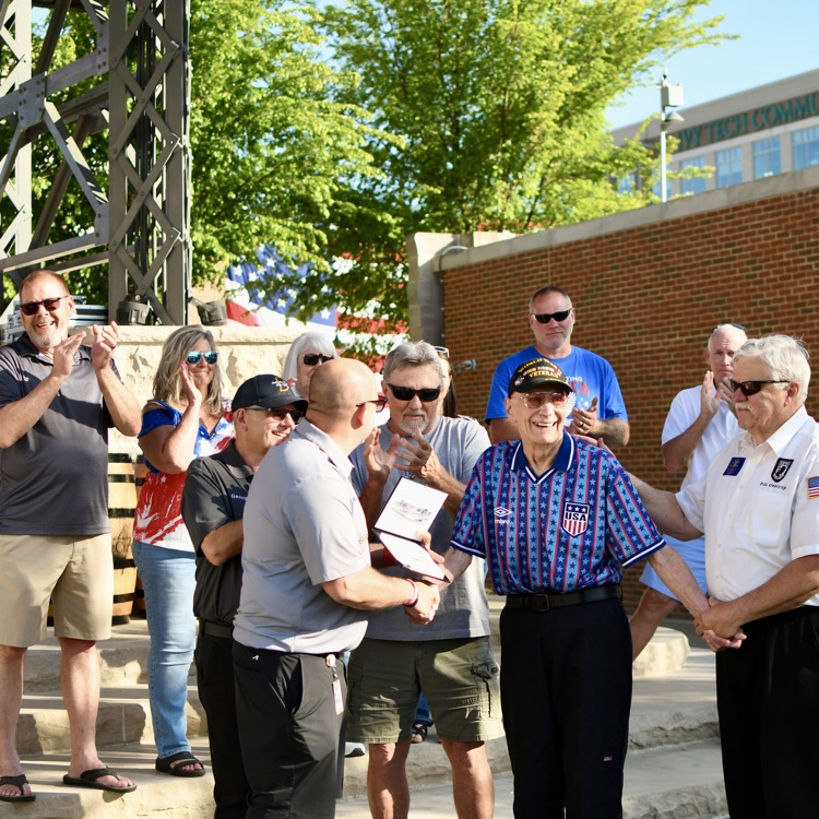 George E. Klopp Sr. receiving a diploma