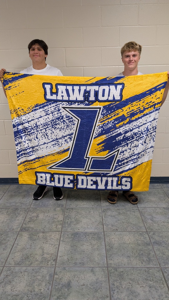 Senior football players Hyden and Greyson showing off our new blanket! 