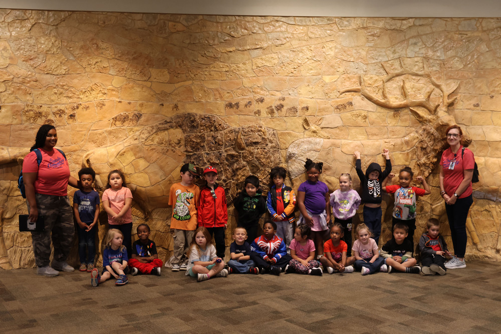 Students take a picture smiling and happy