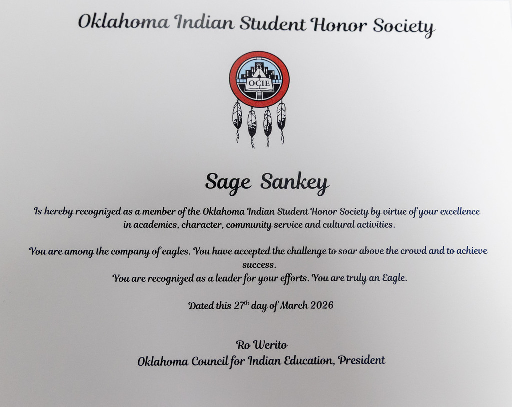 White certificate with text and logo. Logo has feathers and circle with a building. Text reads "Sage Sankey" and "Oklahoma Indian Student Honor Society."