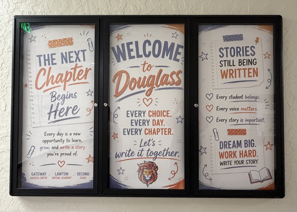 Three black frames on a wall with text: "The Next Chapter Begins Here", "Welcome to Douglass", and "Stories Still Being Written".