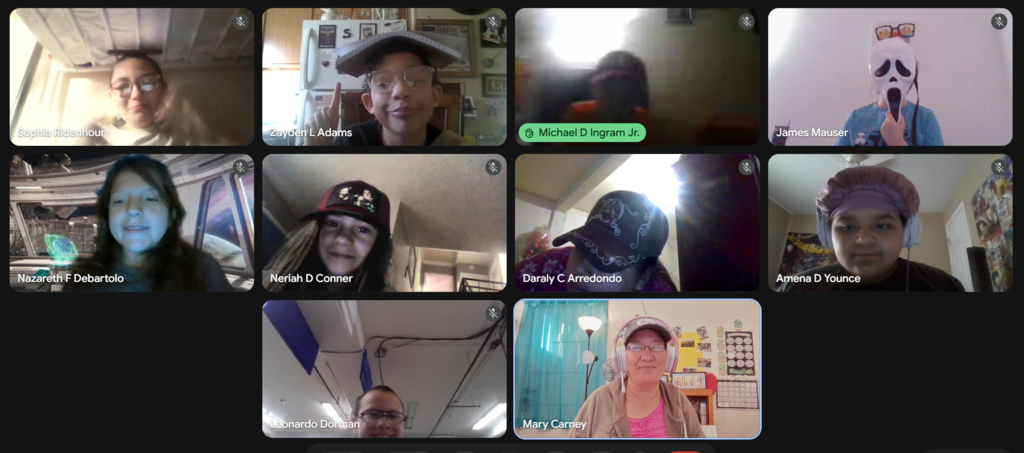 Grid of students and teacher on a video call. Eight students and teacher are visible, each in their own square.