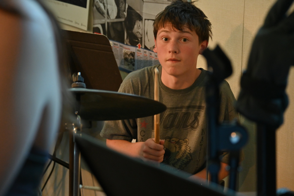 Charlie plays the drums