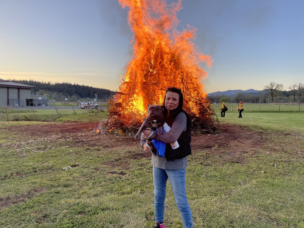 Patty Leone in front of bonfire
