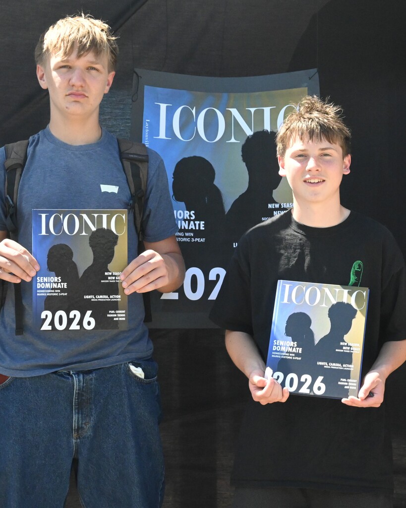 Students pose with their yearbooks