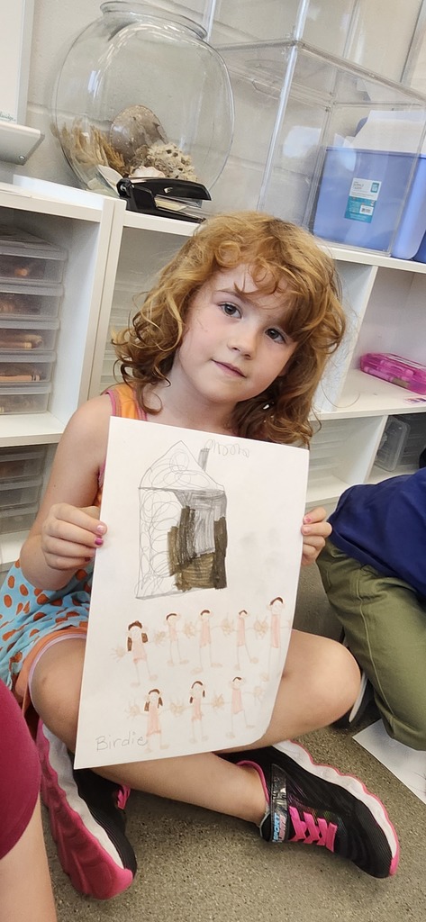 Kindergartners share their drawings about family in art.
