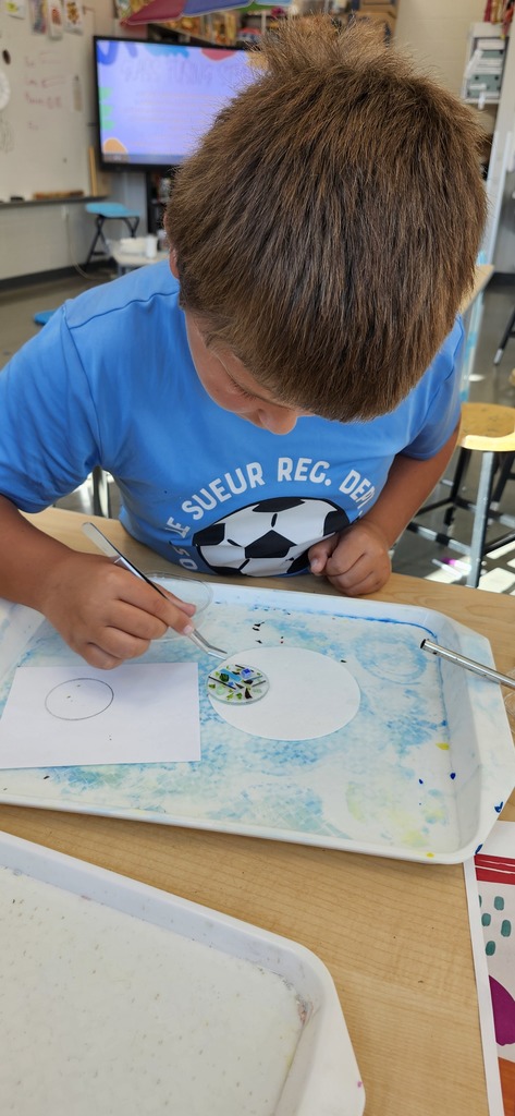 In art students in grades 1-5 learned about glass art for a collaborative work of art for the school windows. 