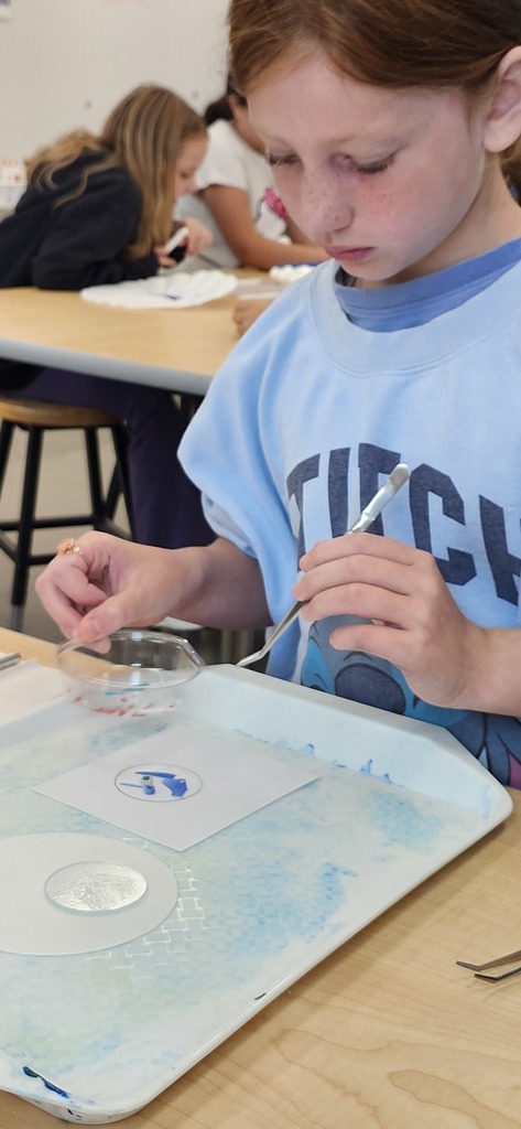 In art students in grades 1-5 learned about glass art for a collaborative work of art for the school windows. 