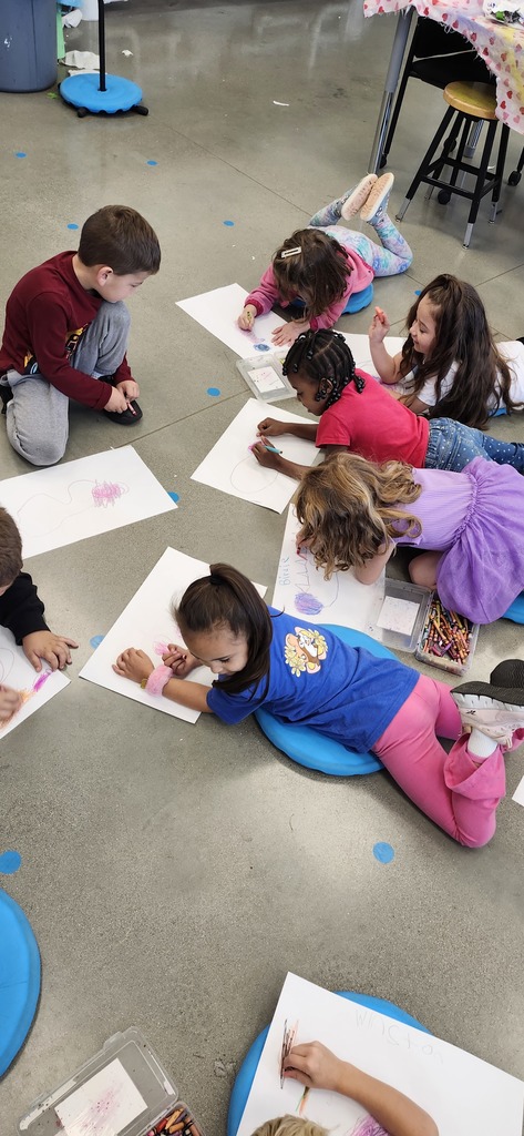 Today in art kindergarteners explored mixing colors with crayons and enjoyed getting to draw laying or sitting on the floor while drawing...a different body position is fun to try!