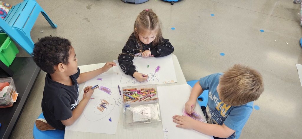 Today in art kindergarteners explored mixing colors with crayons and enjoyed getting to draw laying or sitting on the floor while drawing...a different body position is fun to try!
