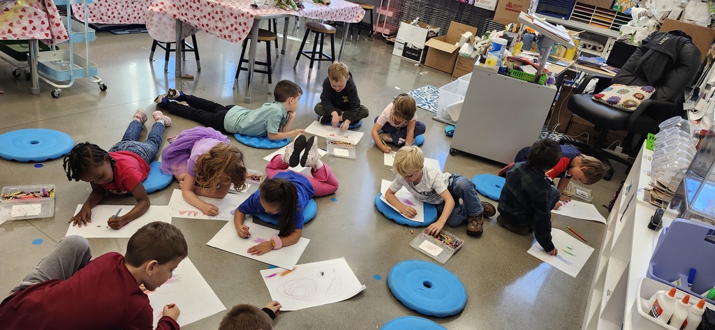 Today in art kindergarteners explored mixing colors with crayons and enjoyed getting to draw laying or sitting on the floor while drawing...a different body position is fun to try!