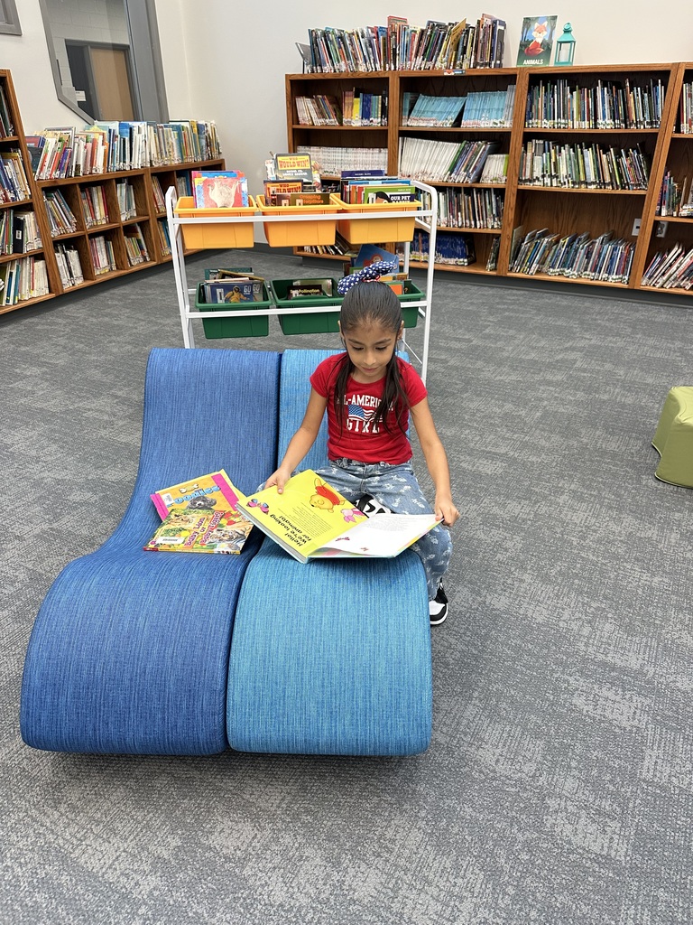 Kindergarten loves snuggling up with a book and a good friend!