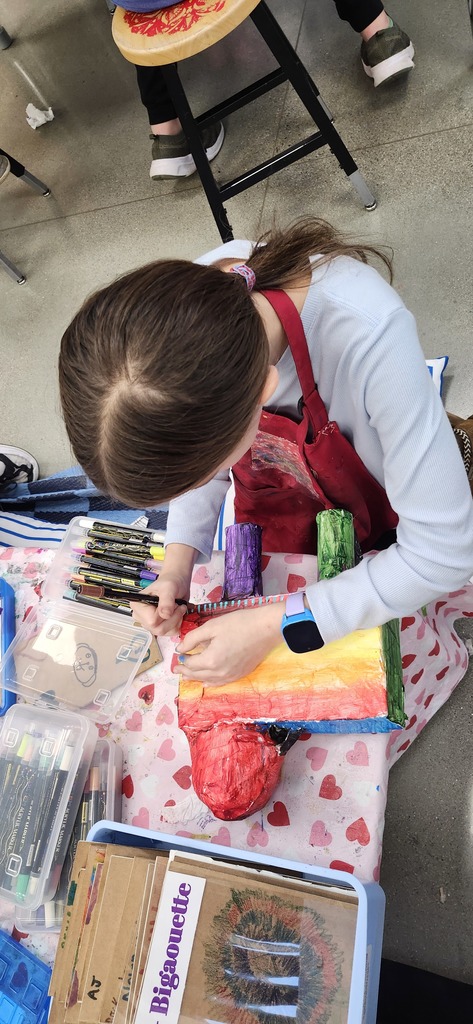 5th graders are all in different places working on their alebrijes inspired animal sculptures.  Some are finishing up with paper mache, some are painting, some adding patterns with paint markers, and a couple have completed them and are doing extension extra choices such as drawing a fantasy place that their animal would live in or writing an adventure story with their alebrije.