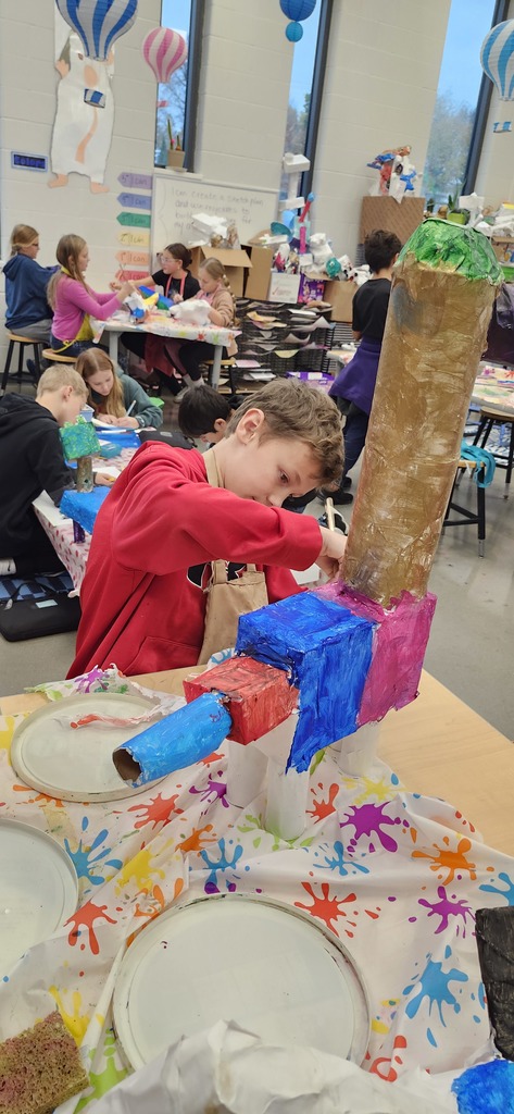 Students are working hard in art to finish painting their alebrije inspired animal sculptures. 