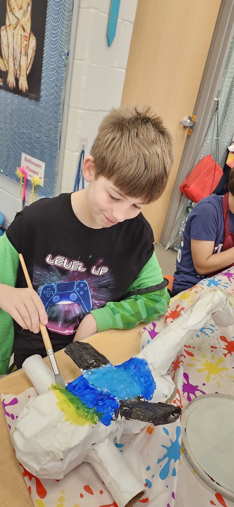 Students are working hard in art to finish painting their alebrije inspired animal sculptures. 