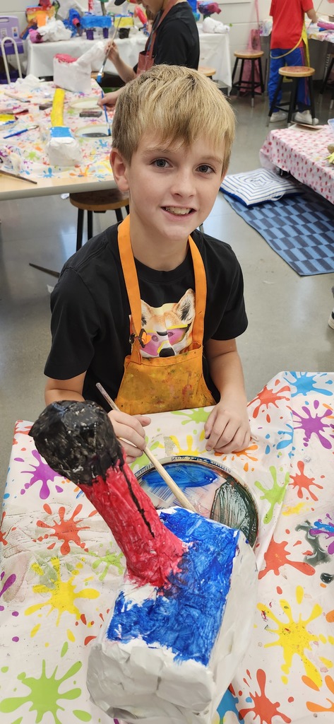 4th graders enjoying painting and patterning their alebrije inspired sculptures. 