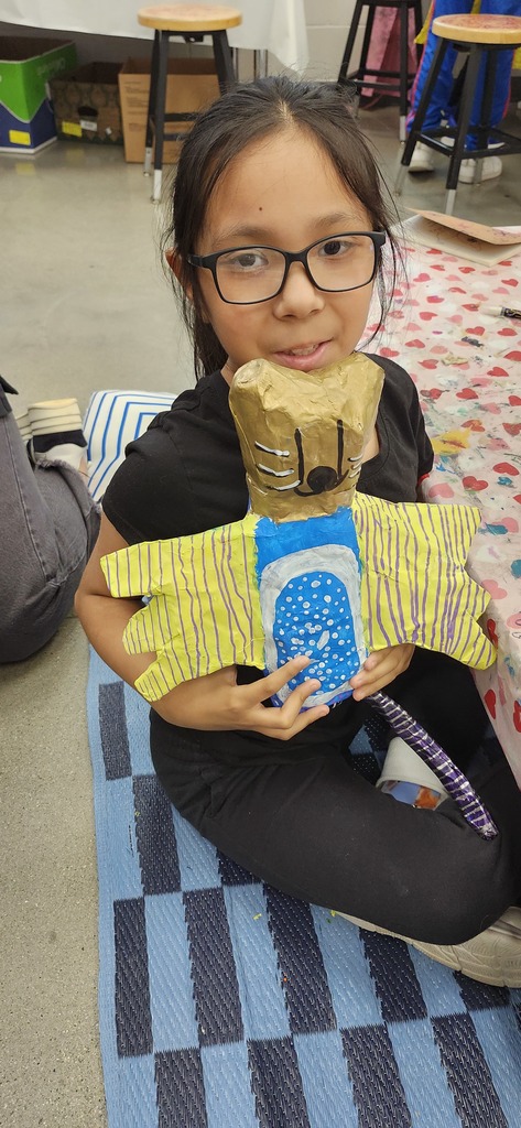 4th graders enjoying painting and patterning their alebrije inspired sculptures. 