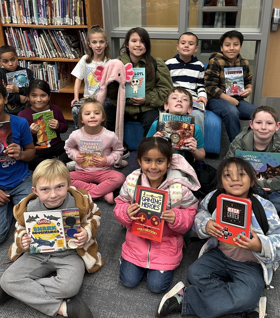 These friends were caught reading and won a free book from the book fair! Thanks to everyone who supported our book fair to support our readers and our library!